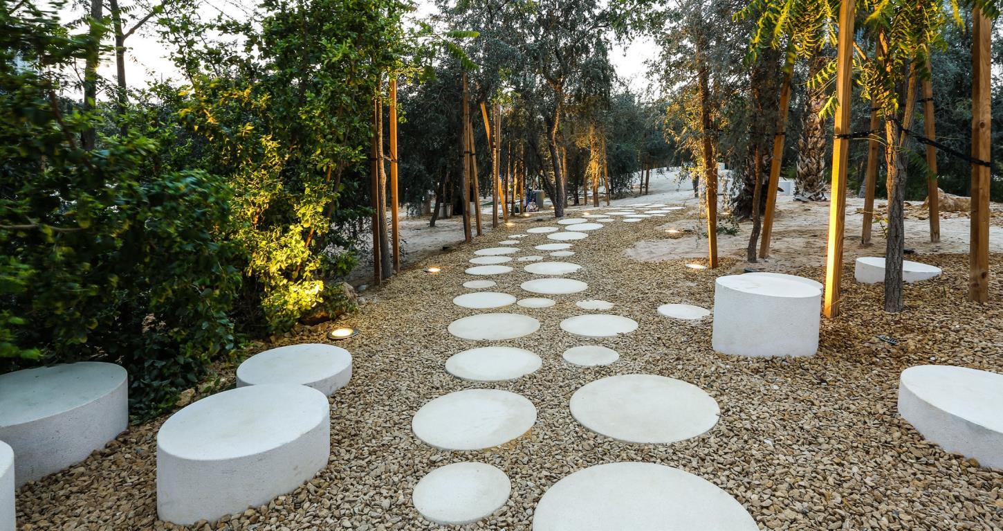 Planted pedestrian landscape integrating trees, groundcover and public realm